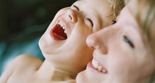 mom-and-son-laughing-awaken