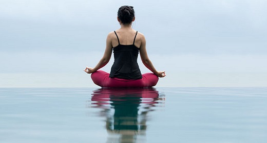 Woman Maintain Balance On The Rocky Mountain While Doing A Floating Lotus  Yoga Pose High-Res Stock Photo - Getty Images