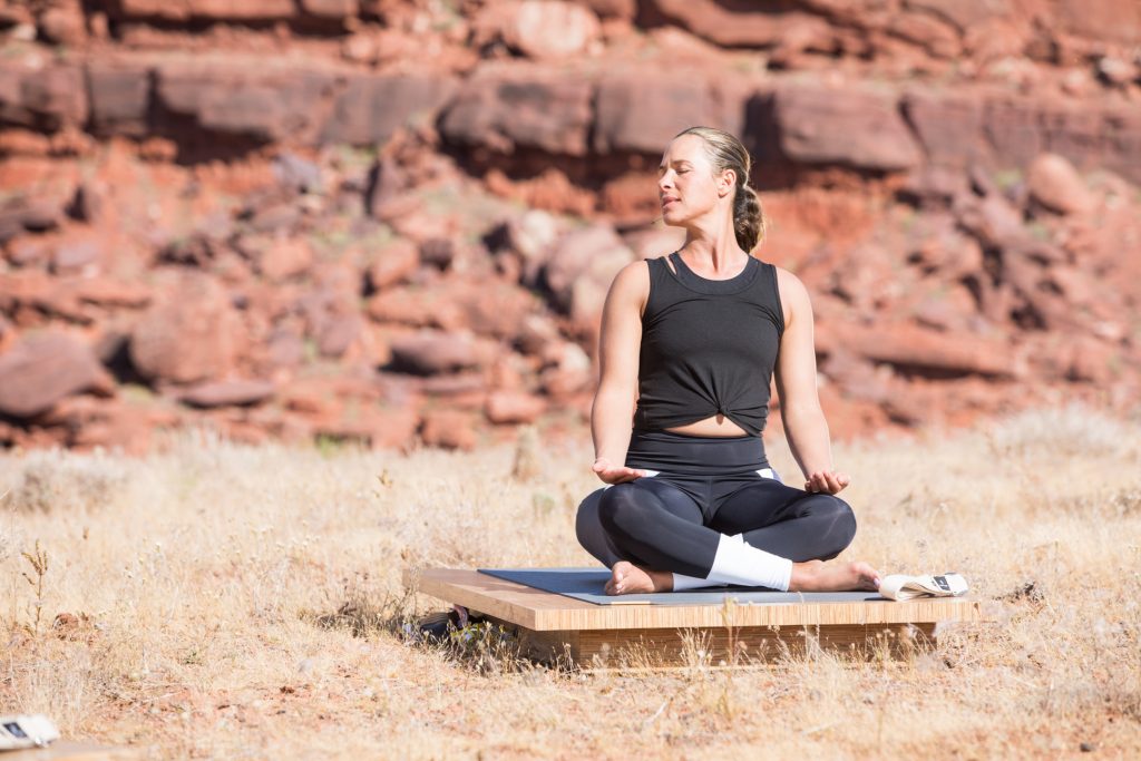 woman practices yoga for her neck -yogatoday