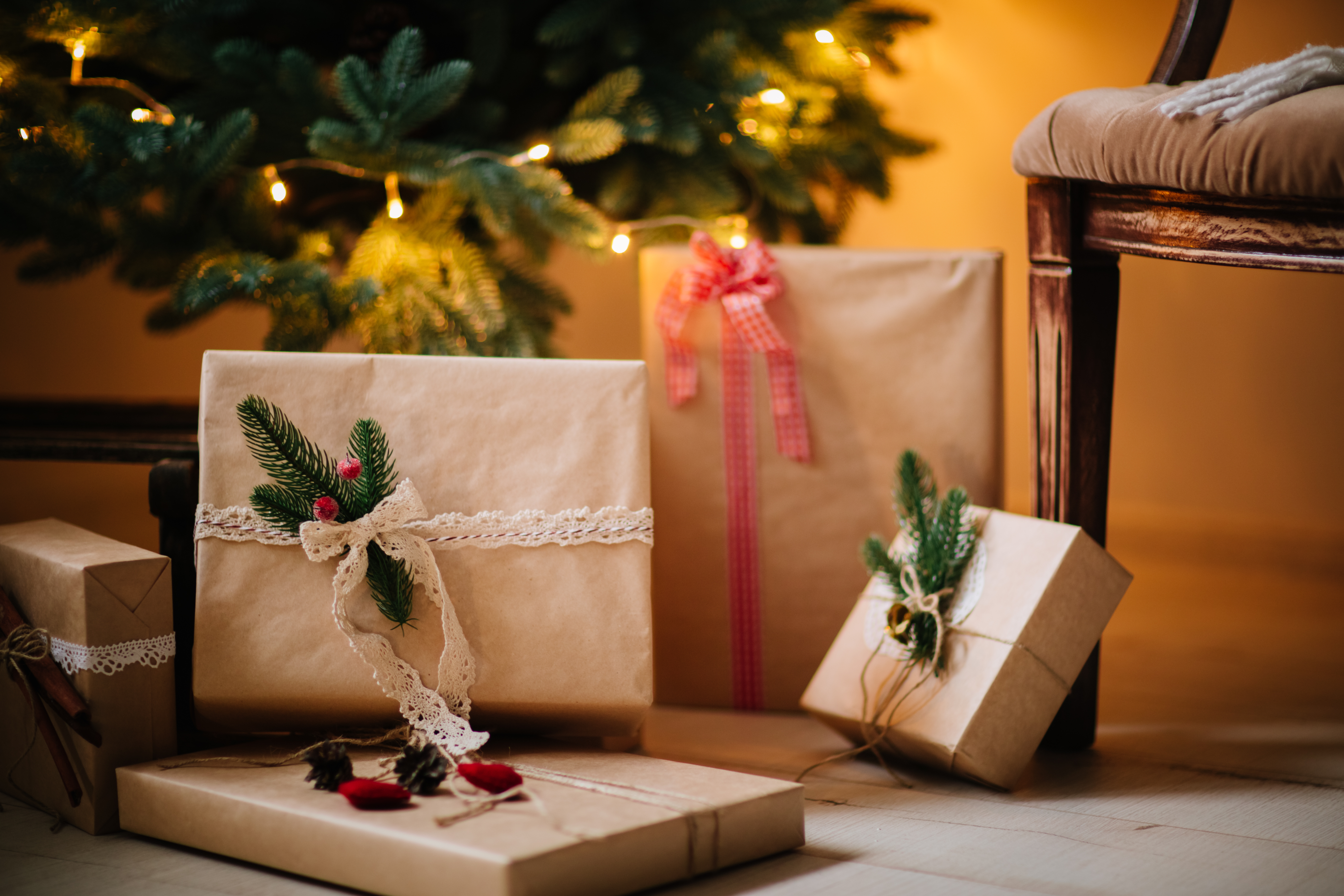 beautiful Christmas gifts under tree in new year decorated house interior