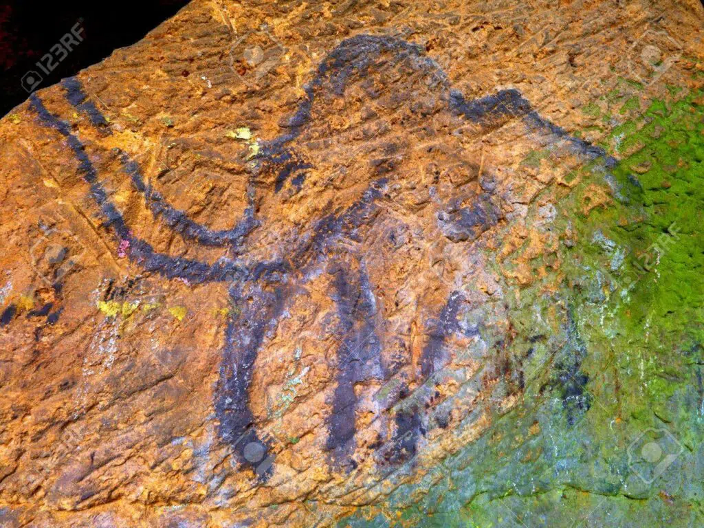 Black carbon mammoth on sandstone wall-awaken