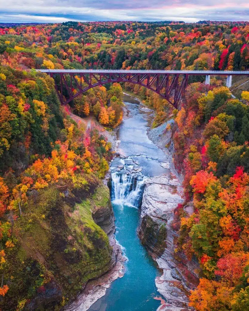 Upstate New York is home to many iconic spots, but one of its most breathtaking views is the renowned Kaaterskill Falls, often photographed with its famous scenic bridge in the Catskill Mountains-awaken